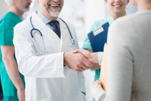 istock Confident doctor shaking patient's hand 938438930