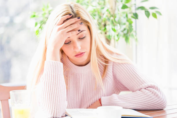 istock Young overworked businesswoman having headache . 938439744