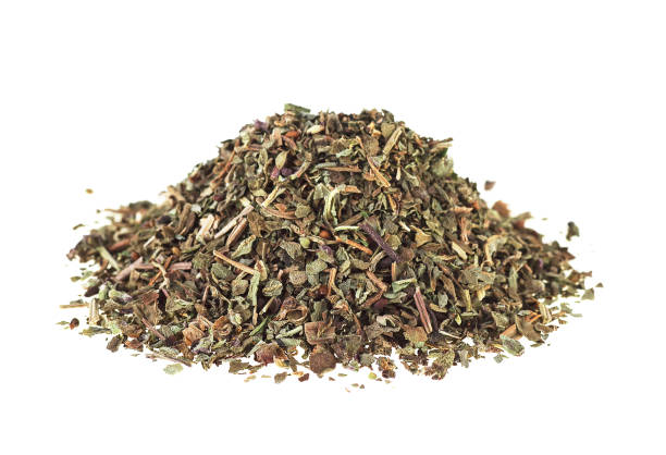 istock Pile of dried basil isolated on a white background 938440104