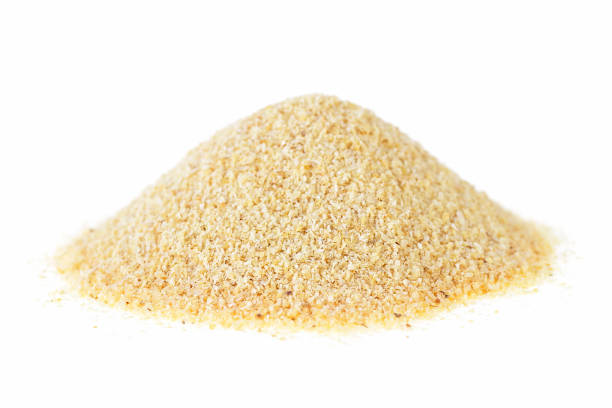 istock Dried granulated garlic on a white background 938442190