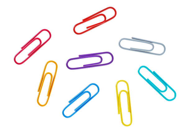 istock Colored paper clips on a white background, closeup 938442228