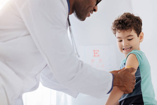 istock Skillful male doctor putting patch 938442356