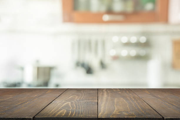 istock Blurred background. Modern kitchen with tabletop and space for you. 938442450