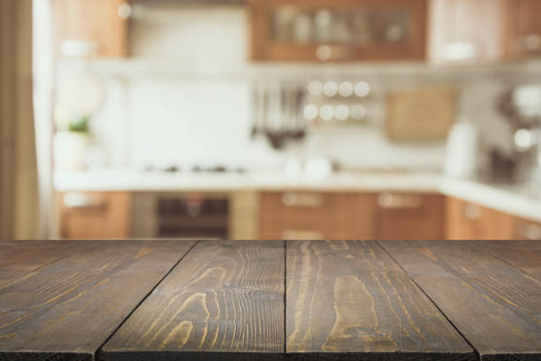 istock Blurred background. Modern kitchen with tabletop and space for you. 938442454