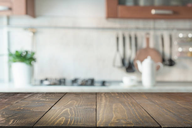 istock Blurred abstract background. Modern kitchen with tabletop and space for display your products. 938442458