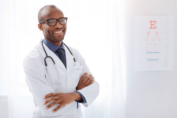 istock Pleasant male doctor performing his work 938442824