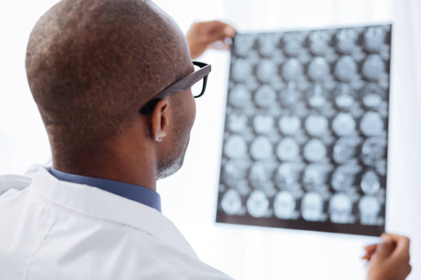 Magnetic resonance imaging Finding  5 cm isodense mass with ill-defined margin and surrounding edema at Left frontal lobe. Glioblastoma, brain metastasis.science and education mri brain background.