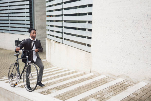 istock Young businessman with bike 938443774