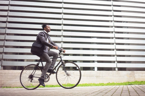 istock Young businessman with bike 938444020