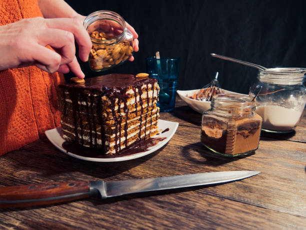 istock Covering homemade cake with chocolate coating 938446414