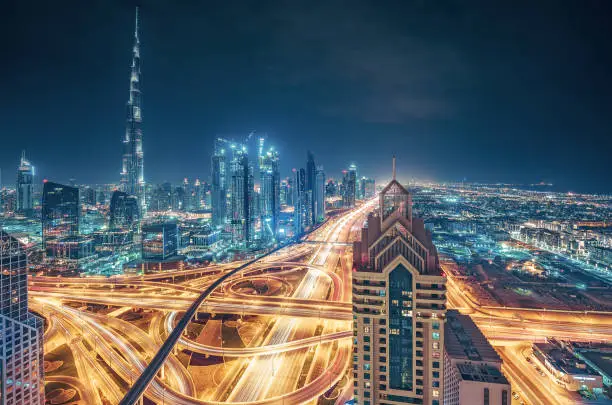 Photo of Scenic nighttime skyline of a big modern city. Dubai, UAE.