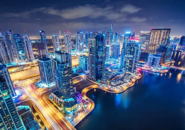 Photo of Scenic aerial view of Dubai Marina creek by night. United Arab Emirates.