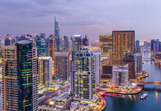 istock Dubai Marina creek with skyscrapers. Scenic nighttime skyline. 938450376