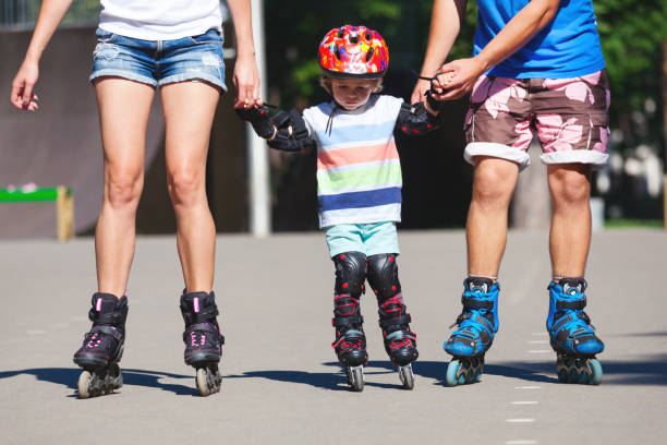 istock Portrait of baby boy learning inline skating. 938454696