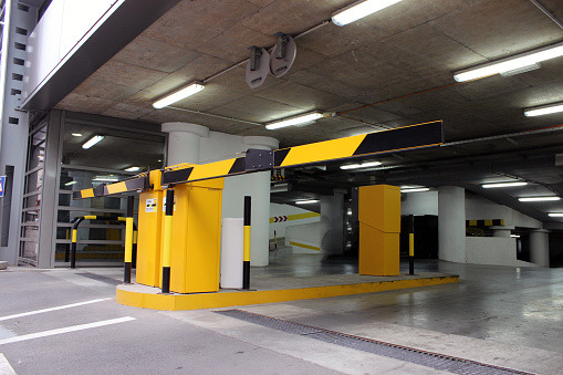 View on a new modern city public parking garage with road signs
