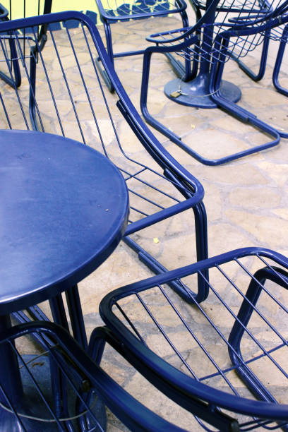 istock Blue metal tables and chairs 938455014