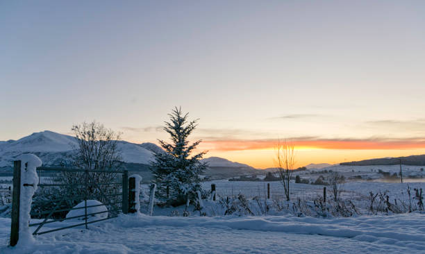 istock Winter sunset on a snowy landscape in the Highlands 938455532