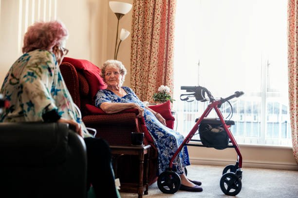 istock Senior Friends in Nursing Home 938456596