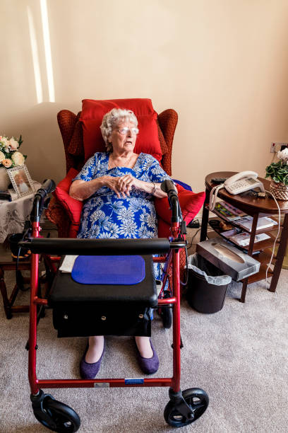 istock Senior Woman Sitting in a Nursing Home 938456754