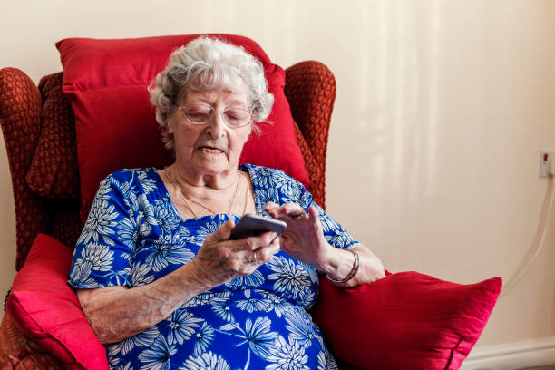 istock Elderly Woman Using A Mobile Telephone 938463172
