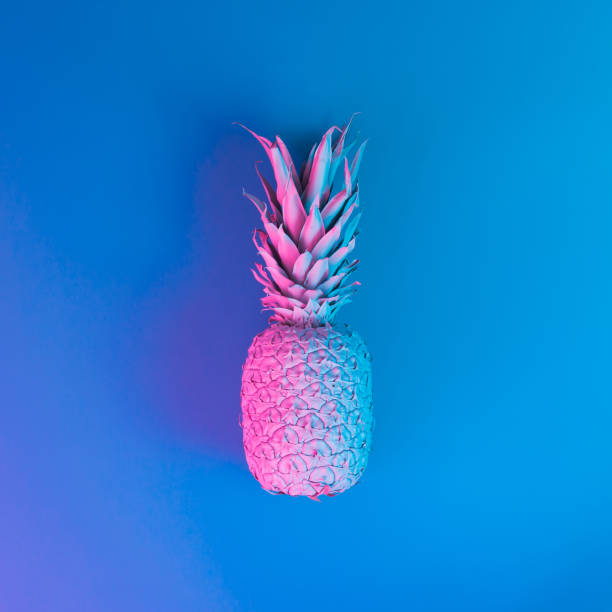 istock Pineapple in vibrant bold gradient holographic neon  colors. Concept art. Minimal surrealism background. 938464228