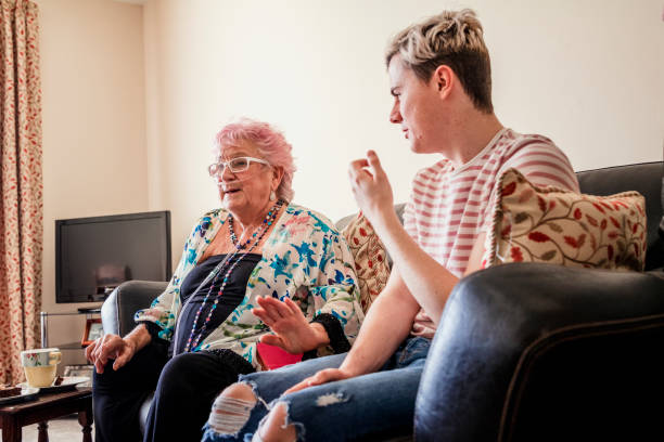 istock Young Man Visits an Elderly Friend 938464234