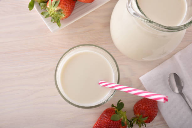 istock Breakfast milk and strawberries on a white kitchen table top 938464756