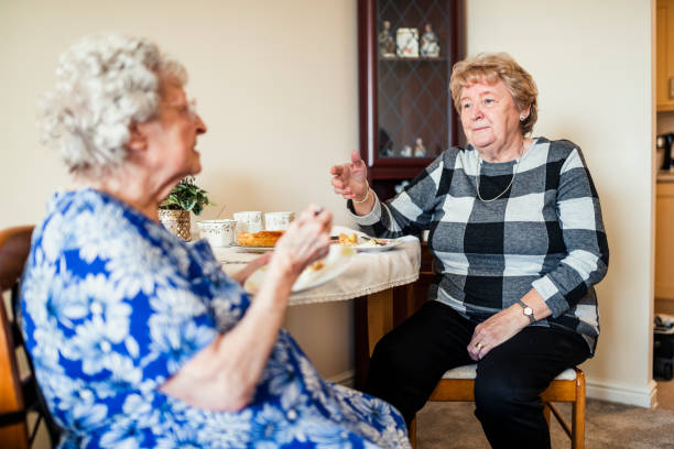 istock Senior Friends Talking over Lunch 938464890