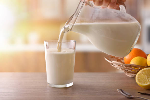 istock Glass of milk for breakfast finished drinking in rustic kitchen 938464908