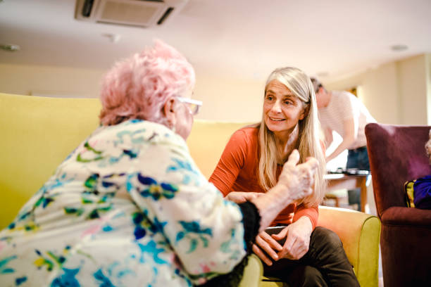 istock Woman Happy Visits a Care Home 938465198
