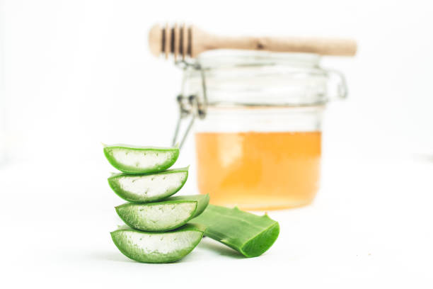 istock Aloe Vera and Honey White background 938473214