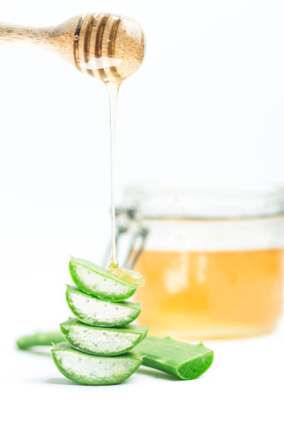 istock Aloe Vera and Honey White background 938473266