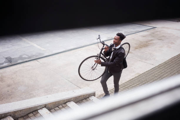 istock Young businessman with bike 938477320