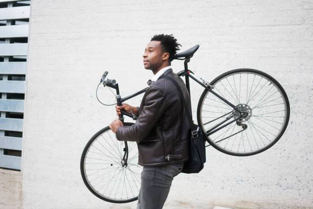 istock Young businessman with bike 938477460