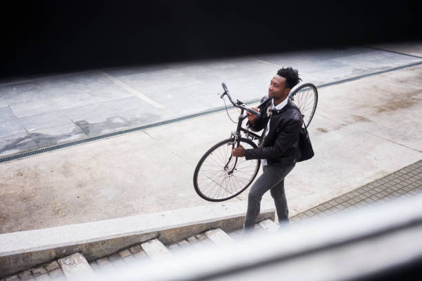 istock Young businessman with bike 938477484
