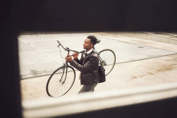 istock Young businessman with bike 938477546