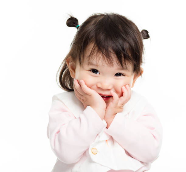 istock closeup happy little girl face 938480262