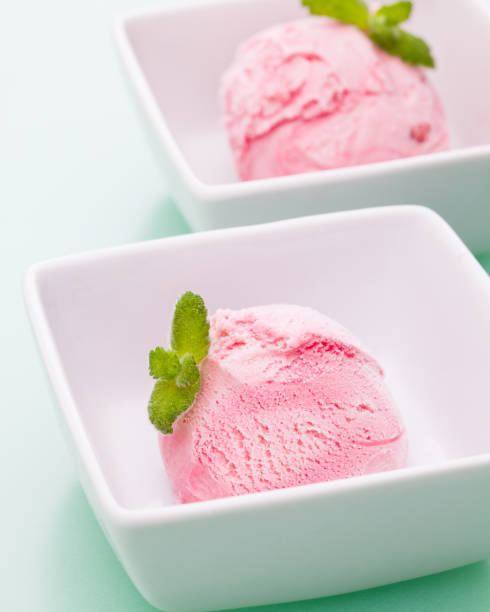 istock two scoops of red ice cream with stripes 938480720