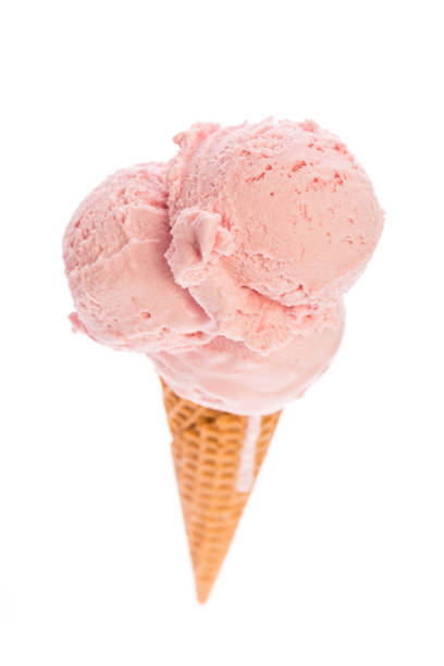 istock ice cream: An ice cream cone with strawberry ice cream isolated on white background - top view 938480744