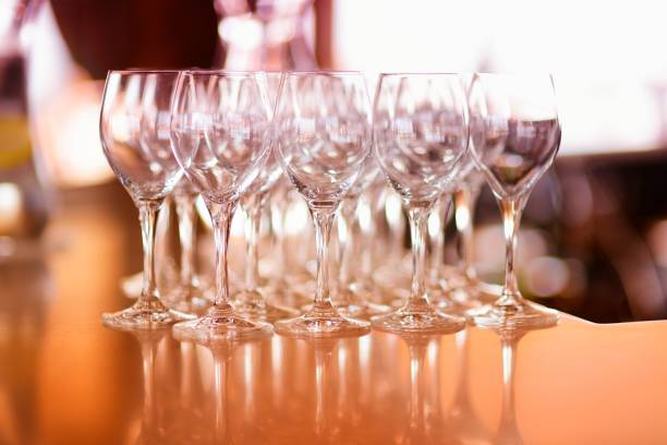 istock Lots of wine glasses during some festive event 938480824