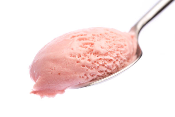 spoon with strawberry ice cream isolated on white