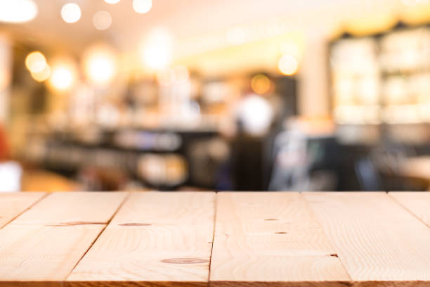 istock Table top counter with Blurred People in Restaurant Cafe background 938484164