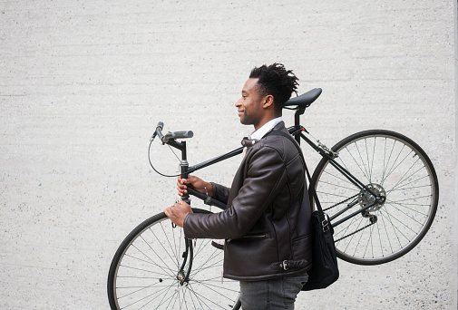 Young businessman with bike
