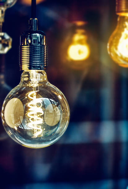 istock Electric lighting bulb with spiral background 938484706