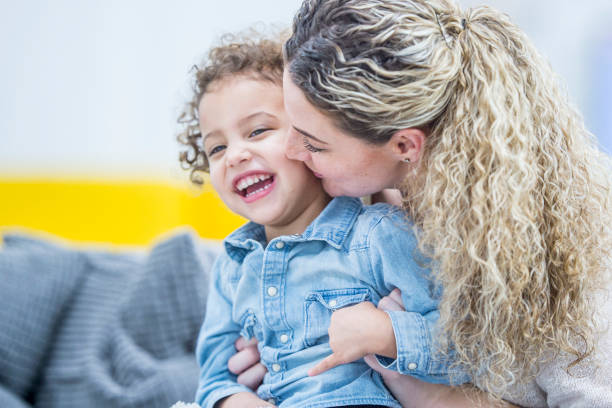 istock Mother Kissing Daughter 938486378