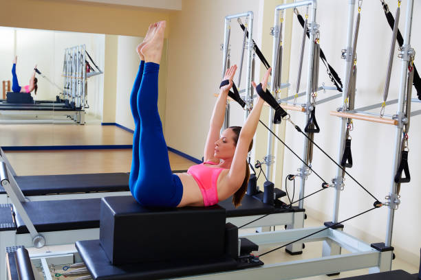 istock Pilates reformer woman back stroke exercise 938486996