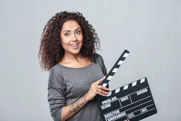 istock Female holding movie clapper board 938487104