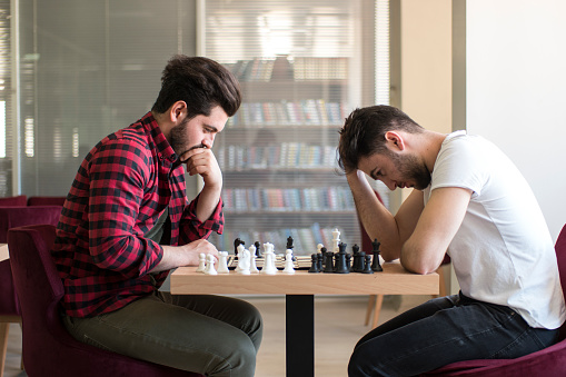 Friends playing chess together