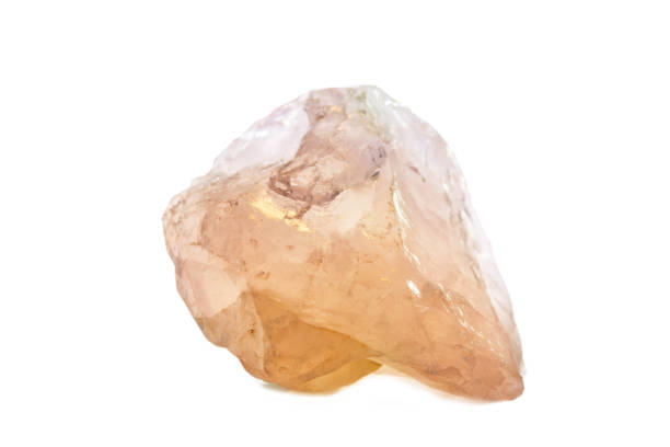 istock Macro shooting of natural gemstone. Raw mineral rose quartz. Isolated object on a white background 938491978