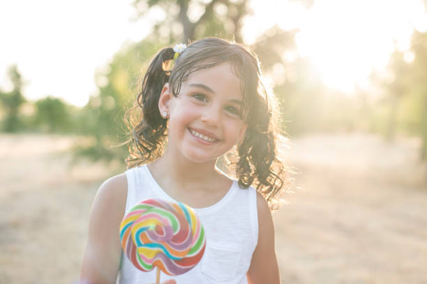istock Little girl showing her candy 938492452
